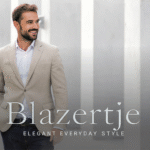 Man wearing a beige Blazertje paired with dark jeans, smiling confidently outdoors — symbolizing elegant everyday style.