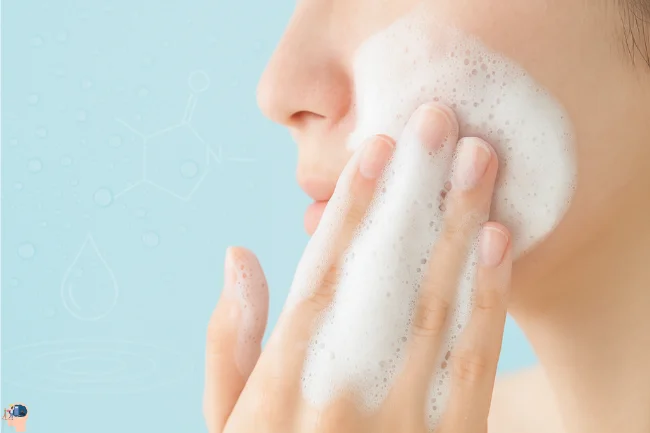 Woman gently cleansing her face with foamy cleanser showing how Disodium EDTA in Skin Care enhances foam and cleaning effectiveness.